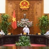 Премьер-министр Фам Минь Тьинь выступает на рабочем заседании (Фото: ВИА)