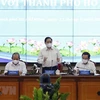Премьер-министр Фам Минь Тьинь выступает на рабочем заседании с официальными лицами Хошимина (Фото: ВИА)