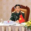 Вьетнамский министр национальной обороны, генерал-полковник Фан Ван Жанг на онлайн-беседу с министром обороны Японии Киши Нобуо 3 июня (Источник: ВИА)