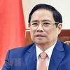 Премьер-министр Фам Минь Тьинь выступает на глобальном Саммите по торговле услугами 2021 года в виде видеозаписи. (Фото: Зыонг Жанг/ВИА)