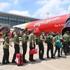 Рейс VietJet Air доставил офицеров общественной безопасности и сотрудников в Хошимин (Фото: ВИА) 