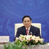 Премьер-министр Фам Минь Тьинь на мероприятии. (Фото: ВИА)