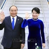 Президент Нгуен Суан Фук с супругой. (Фото: Тхонг Нят/ВИА)