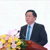 Глава Отдела ЦК КПВ по пропаганде и политическому просвещению Нгуен Чонг Нгиа выступает на конференции. (Фото: ВИА)