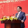 Премьер-министр Фам Минь Тьинь выступает на национальной конференции по выполнению государственного бюджета в 2022 году. (Фото: ВИА)