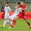 Игроки Вьетнама (в белом) и Китая в предыдущем матче азиатской квалификации ЧМ-2022 (Фото: Getty Images) 