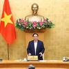 Премьер-министр Фам Минь Тьинь выступает на открытии заседания правительства в январе 2022 года. (Фото: ВИА)
