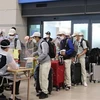 Вьетнамские рабочие проходят иммиграционные процедуры в аэропорту Инчхон, Южная Корея. (Фото: ВИА)