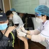 Вакцинация от COVID-19 в Ханое. (Фото: ВИА) 
