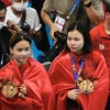 Нго Фыонг Май и Май Хонг Хань завоевывают серебряную медаль в синхронных прыжках в воду с 3-метрового трамплина среди женщин 9 мая. (Фото: ВИА)