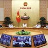 Заместитель премьер-министра Ле Ван Тхань (в центре) председательствует на совещании 14 июня. (Фото: ВИА)