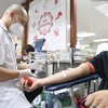 Доброволец сдает кровь в день запуска кампании по донорству крови. (Фото: ВИА)