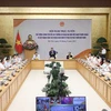 Премьер-министр Фам Минь Тьинь провел онлайн-конференцию премьер-министра с главами вьетнамских представительств за рубежом. (Фото: Зыонг Жанг/ВИА)
