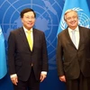 Постоянный заместитель премьер-министра Фам Бинь Минь и Генеральный секретарь ООН Антонио Гутерриш. (Фото: VGP)