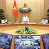 Премьер-министр Фам Минь Тьинь провел онлайн-конференцию между правительством и местными органами власти, а также очередное заседание правительства в сентябре 2022 года. (Фото: Зыонг Жанг/ВИА)