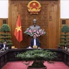 Премьер-министр Фам Минь Тьинь председательствовал на заседании Постоянного комитета правительства по фискальной и денежно-кредитной политике. (Фото: ВИА)