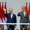 Президент Нгуен Суан Фук и президент Индонезии Джоко Видодо. (Фото: Тхонг Нят/ВИА)