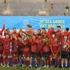 Вьетнамские игроки радуются победе в мужском футбольном финале против Таиланда 22 мая. (Фото: ВИА)