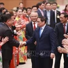 Премьер-министр Фам Минь Тьинь и зарубежные вьетнамцы посещают программу «Весна Родины 2023». (Фото: Зыонг Жанг/ВИА)