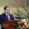 Премьер-министр Фам Минь Тьинь пожелал банковской отрасли с Tэt. (Фото: Зыонг Жанг/ВИА)