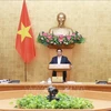 Премьер-министр Фам Минь Тьинь провел онлайн-конференцию между правительством и местными органами власти. (Фото: Зыонг Жанг/ВИА)