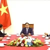 Премьер-министр Фам Минь Тьинь провел телефонный разговор с премьер-министром Китая Ли Цяном 4 апреля. (Фото: ВИА)