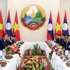 Президент Во Ван Тхыонг совершил встречу с премьер-министром Лаоса Сонексаем Сипандоне. (Фото: ВИА)