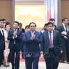 Премьер-министр Фам Минь Тьинь принял участие во встрече с иностранными инвесторами. (Фото: Зыонг Жанг/ВИА)