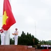 На церемонии поднятия национального флага га острове Кото. (Фото: ВИА)