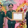 Президент Во Ван Тхыонг наградил Орденом Заслуги первой степени Главное управление II Министерства национальной обороны. (Фото: Тхонг Нят/ВИА)