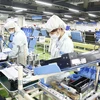 Современная линия по производству принтеров на Вьетнамской компании Canon - одном из крупных предприятий с инвестиционным капиталом из Японии. (Фото: hanoimoi.com.vn)