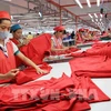 Компания Star Fashion Co., Ltd. построила фабрику по пошиву трикотажной и спортивной одежды на экспорт в США в промышленном парке Фунгиа, уезд Чыонгми, Ханой. (Фото: Чан Вьет/ВИА)