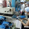 Производство обуви на экспорт в Ханое. (Фото: Чан Виет/ВИА)