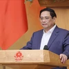 Премьер-министр Фам Минь Тьинь председательствует на очередном заседании правительства в сентябре 2023 года и онлайн-конференции правительства с местностями. (Фото: Зыонг Жанг/ВИА)