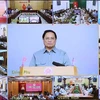 Премьер-министр Фам Минь Тьинь возглавил Конференцию по борьбе с незаконной добычей морепродуктов. (Фото: Зыонг Жанг/ВИА)