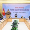 Премьер-министр Фам Минь Тьинь председательствует на конференции. (фото ВИА)