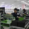 Рабочие на предприятии Samsung Electronics Vietnam в Бакньинь (Фото: ВИA)