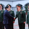 Премьер-министр Фам Минь Тьинь наносит визит в 2-е Главное управление в преддверии Тэта 26 января (Фото: ВИA)