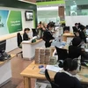 Vietcombank проводит множество рекламных программ для своих услуг по переводу денежных средств в преддверии Tэт. (Фото: ВИA)