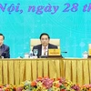 Премьер-министр Фам Минь Тьинь (в центре) председательствует на конференции, посвященной задачам развития фондового рынка в этом году, 28 февраля. (Фото: ВИA)