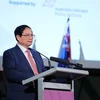 Премьер-министр Фам Минь Тьинь выступает на Вьетнамско-Австралийском бизнес-форуме в Мельбурне 5 марта (Фото: ВИA)