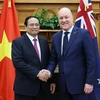 Премьер-министр Вьетнама Фам Минь Тьинь (слева) и его новозеландский коллега Кристофер Люксон в Веллингтоне 11 марта (Фото: ВИA)