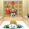 Премьер-министр Фам Минь Тьинь (в центре) принимает высокопоставленную делегацию Делового совета США-АСЕАН. (Фото: ВИA)