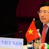 Вице-премьер-министр и министр иностранных дел Фам Бинь Минь возглавил вьетнамскую делегацию на конференции. (Фото: Хыу Киен/ВИА) 