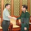越南国防部长冯光青大将会见中国驻越南大使馆武官甄中兴大校