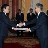 越南国家主席张晋创接受老挝新任越南大使冯沙万·丰威汉递交的国书（图片来源：越通社）