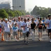 胡志明市和附近省份居民参加特里·福克斯义跑活动（图片来源：越通社）