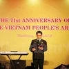 12月18日在老挝举行的越南人民军建军71周年纪念典礼（图片来源：越通社）
