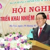 越南社会政策银行行长杨决胜在会议上发表讲话
