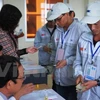 越南劳工人办理劳务输出手续（图片来源：越通社）